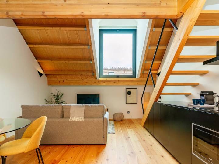 Open plan living room and kitchen in the Cosy Japandi style apartment