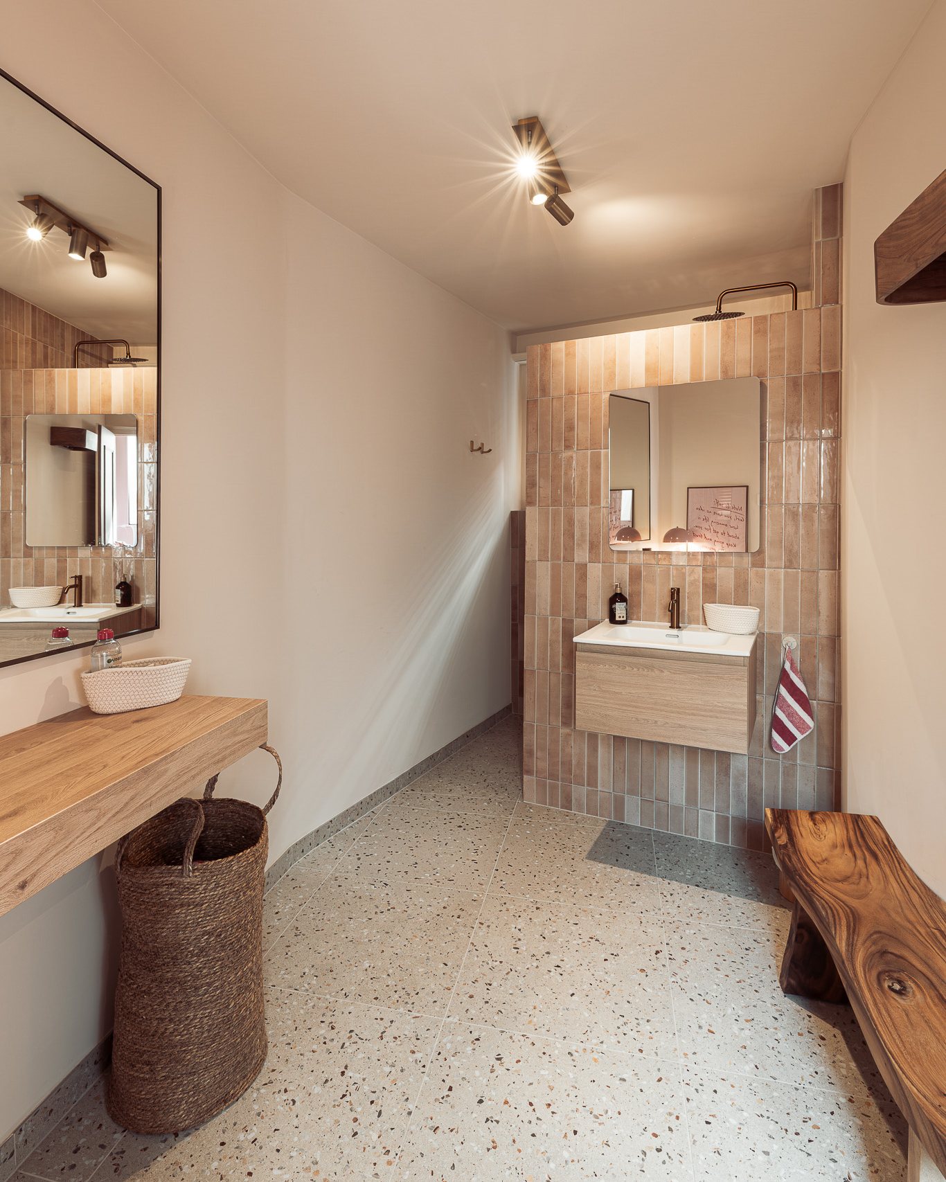 Vanity area with tiled wall, oak shelf and wooden bench