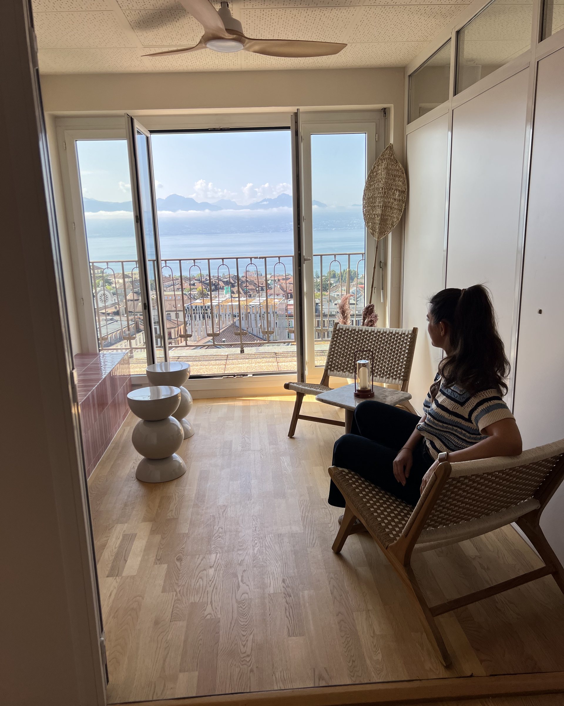Alessia Di Dio sitting in the finished lounge looking at the view
